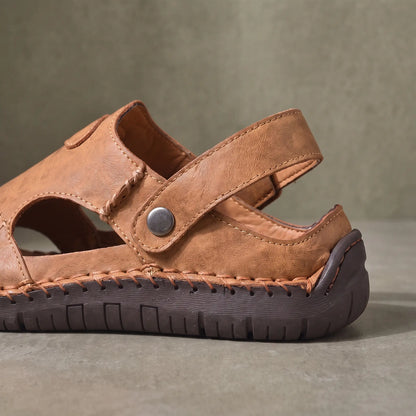 Close up of the metal snap instep strap, closed heel and thick rubber bottom on the light brown Snap Strap Sandals