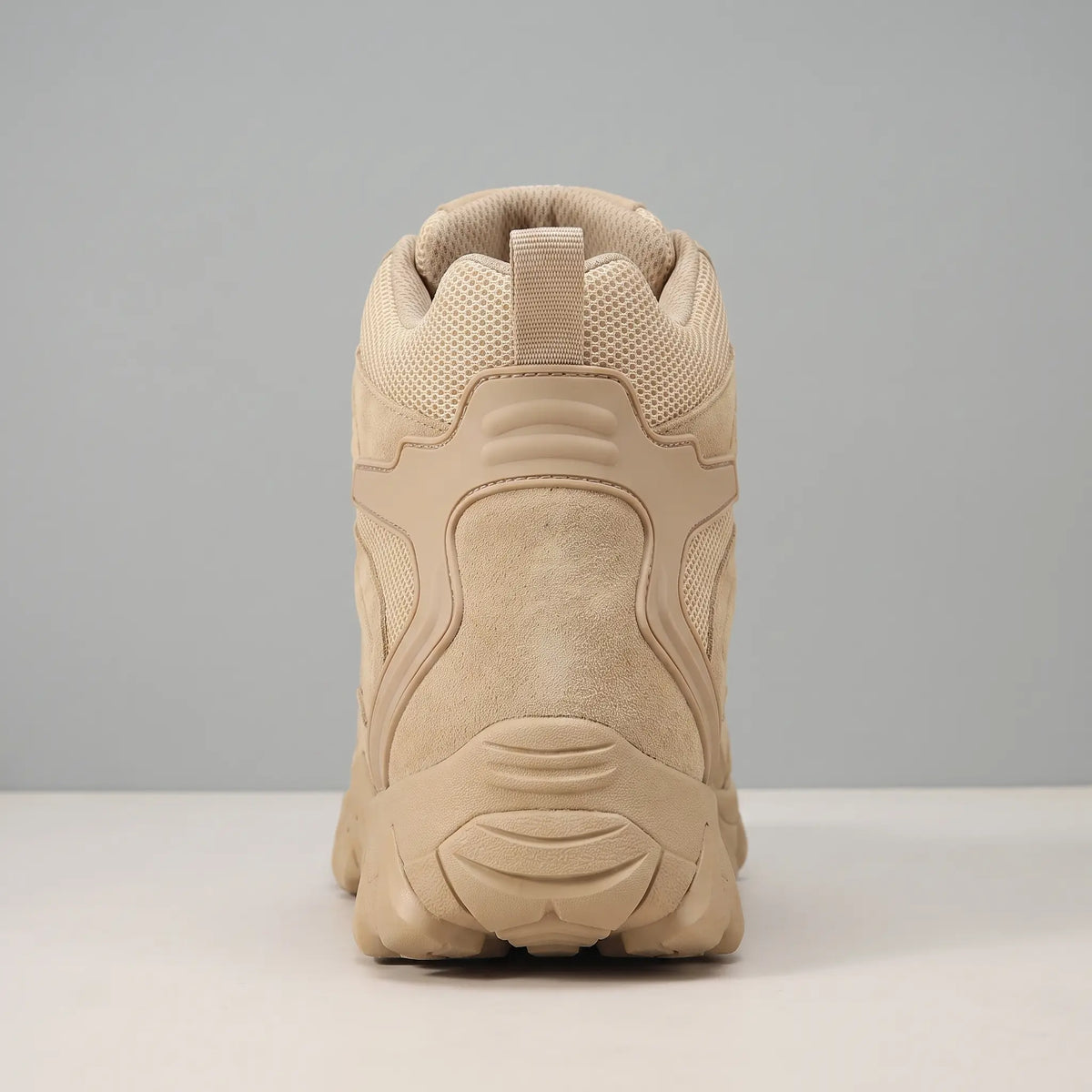 Rear view of the padded collar, heel counter, pull loop and layered sole on the beige Soft Suede Hikers