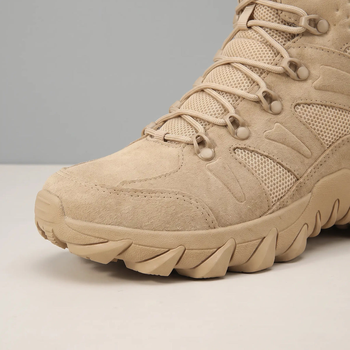 Close up of the suede toe, mesh panels and fabric lace loops on the beige Soft Suede Hikers
