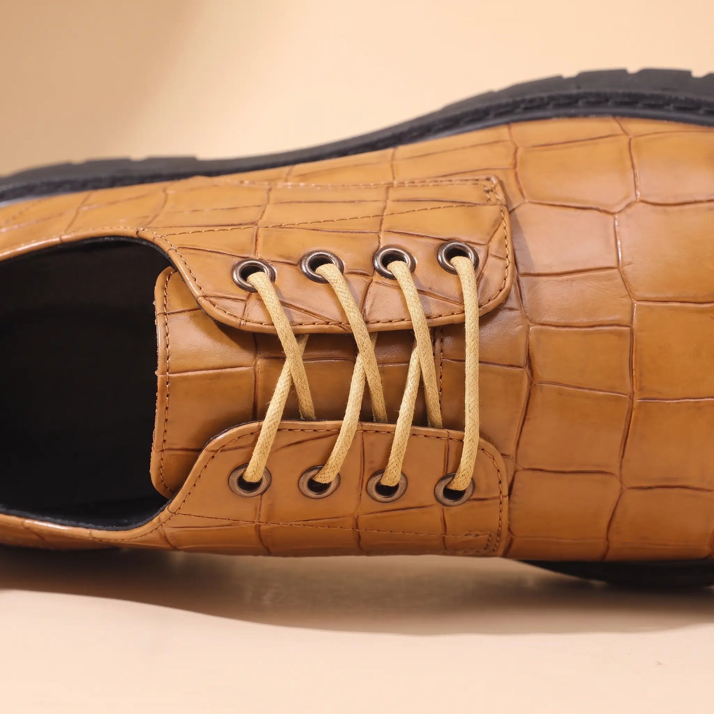 Close up of the open derby lacing, metal eyelets and laces on the tan Square Scale Derby