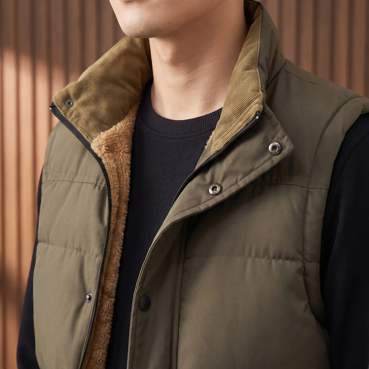 Close up of the corduroy faced stand collar, zip and snap placket on Stand Collar Vest