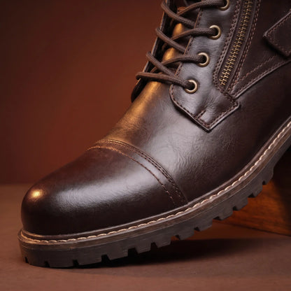 Close up of the cap toe seam, eyelets and lugged sole on the Strapped Biker Boots