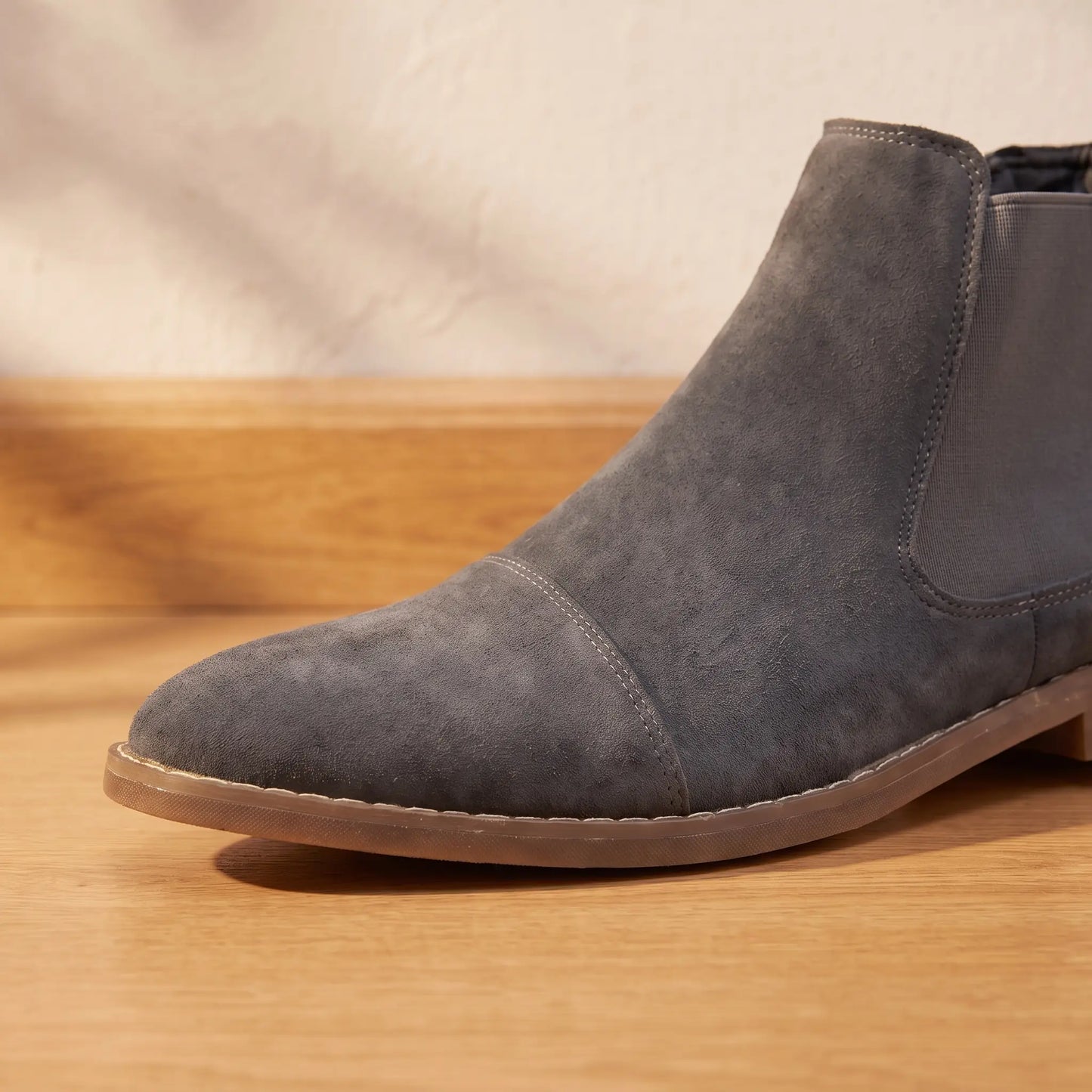Close up of the pointed toe, stitched welt and flat sole on the Stretch Panel Boots