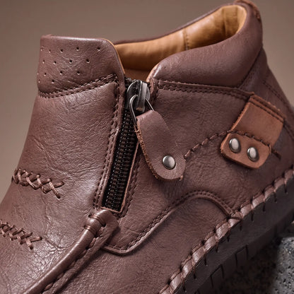 Close up of the side zip and studded leather strap on Stud Strap Boots
