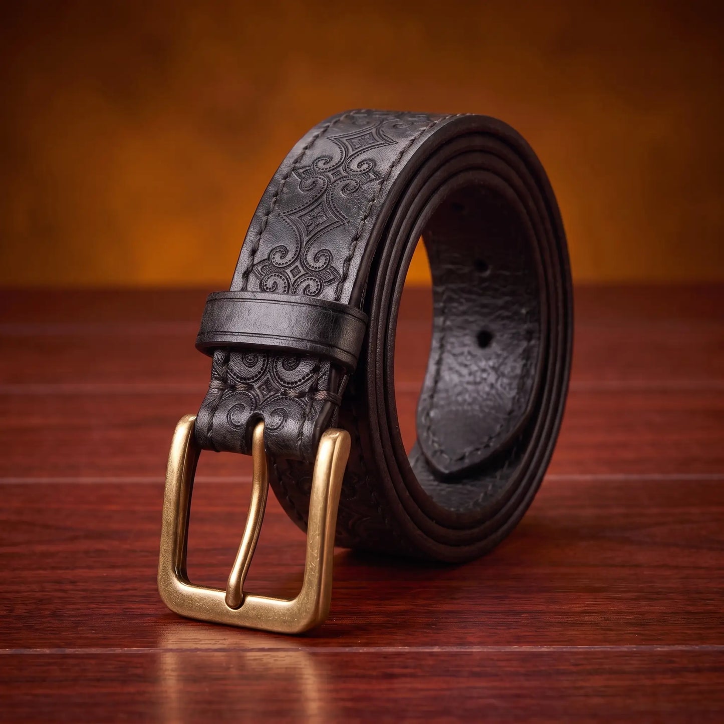 Tooled Pattern Belt in black cowhide with carved scroll pattern and antique brass buckle