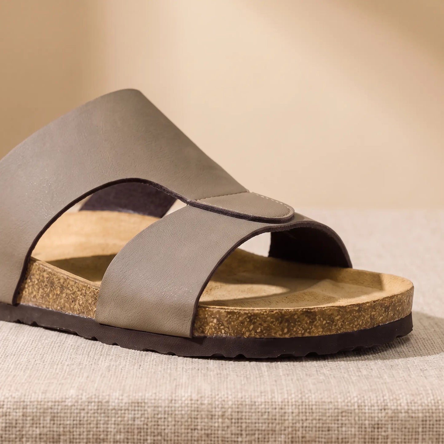 Close up of the two front bands, edge stitching and moulded toe ridge on the taupe Two Strap Slides