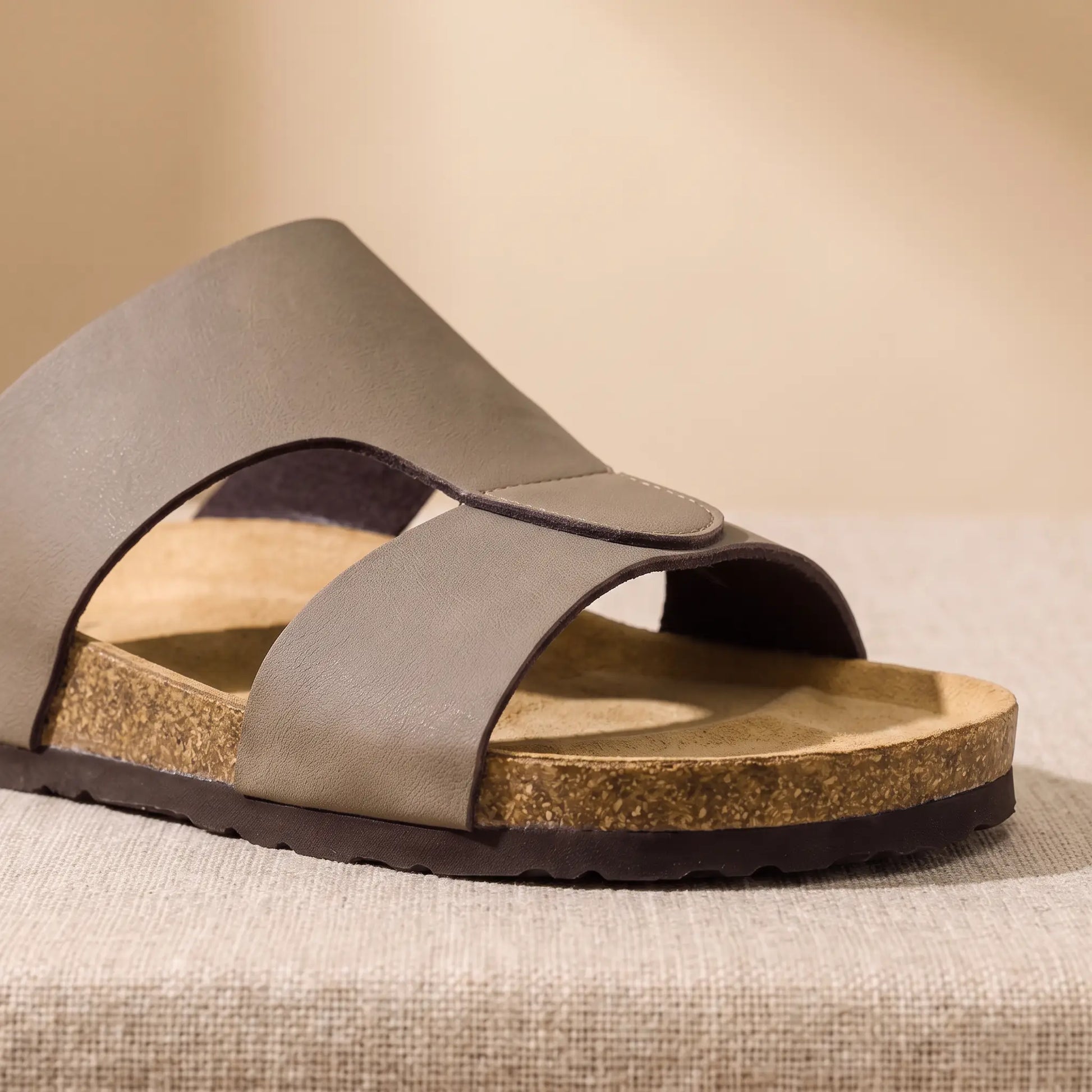 Close up of the two front bands, edge stitching and moulded toe ridge on the taupe Two Strap Slides