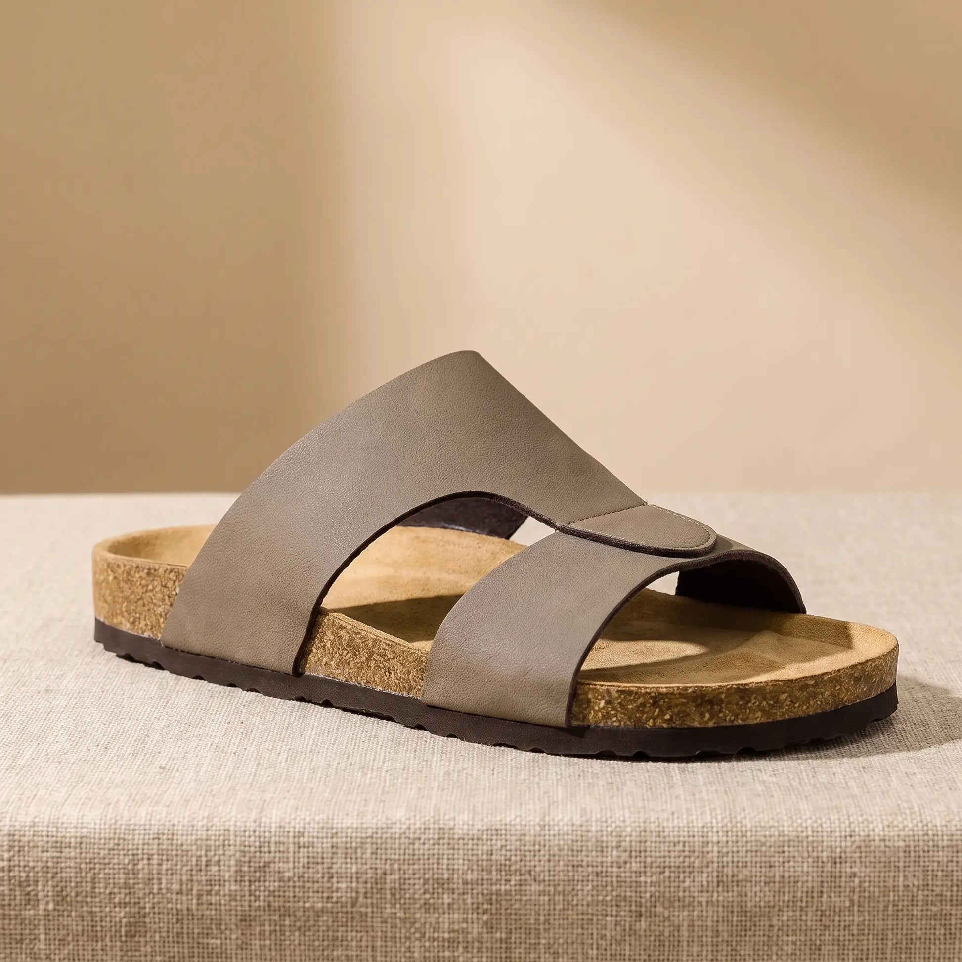 Two Strap Slides in taupe, a cork footbed slide with two wide bands across the front, on a linen platform