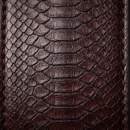 Macro close up of the pressed snake scale texture in the leather on the Two Tone Buckle Belt