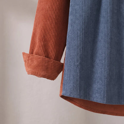 Close up of the turned back cuff and straight hem on the rust and blue Two Tone Overshirt