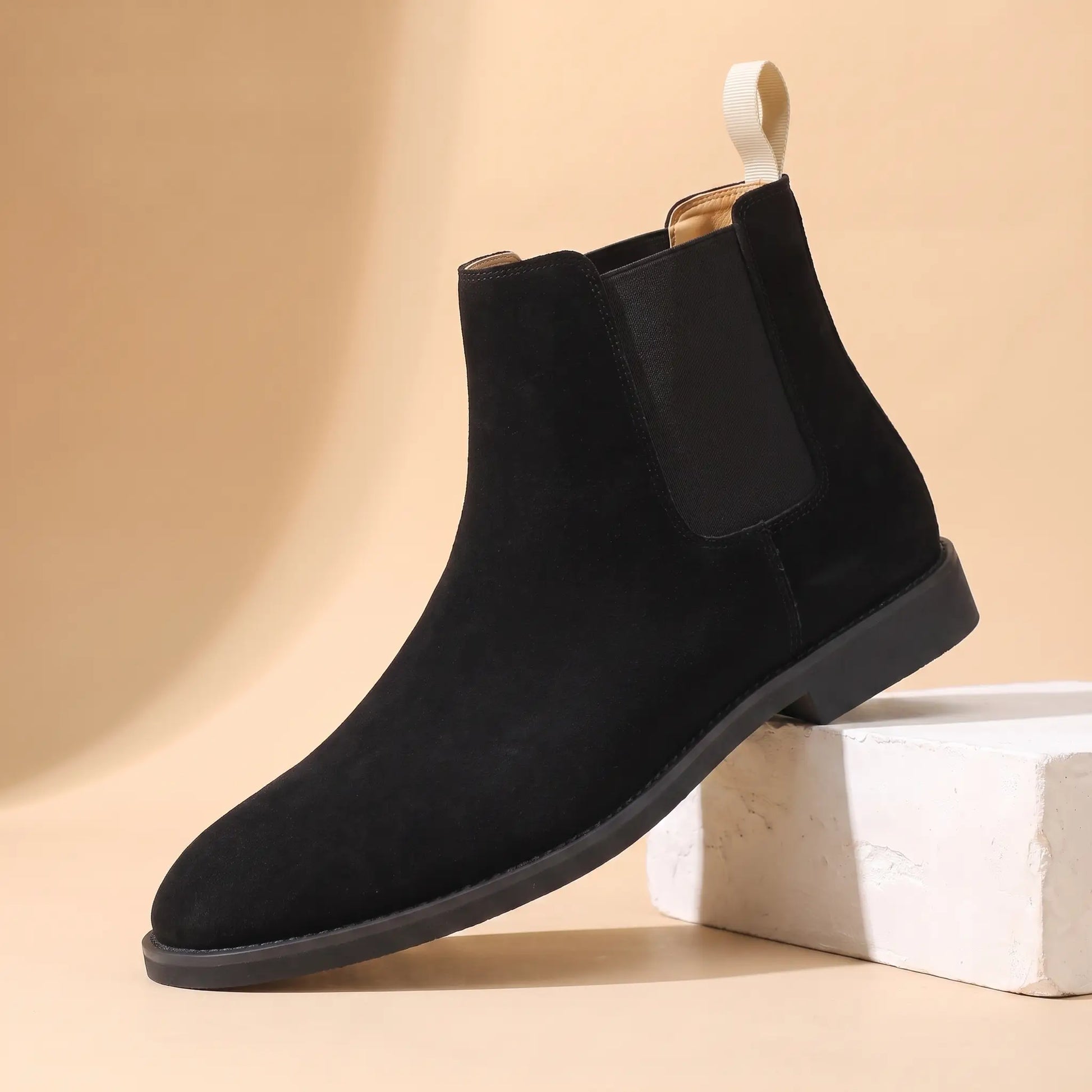 Webbing Tab Boots in black, a leather Chelsea boot with a cream heel pull loop
