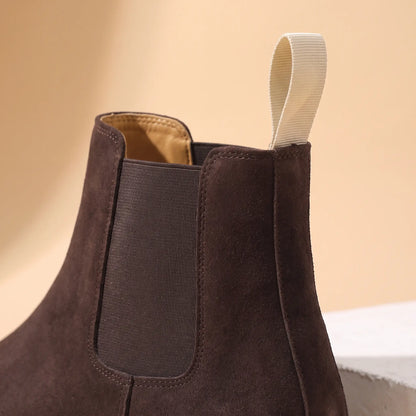 Close up of the elastic side panel and cream webbing heel loop on the Webbing Tab Boots