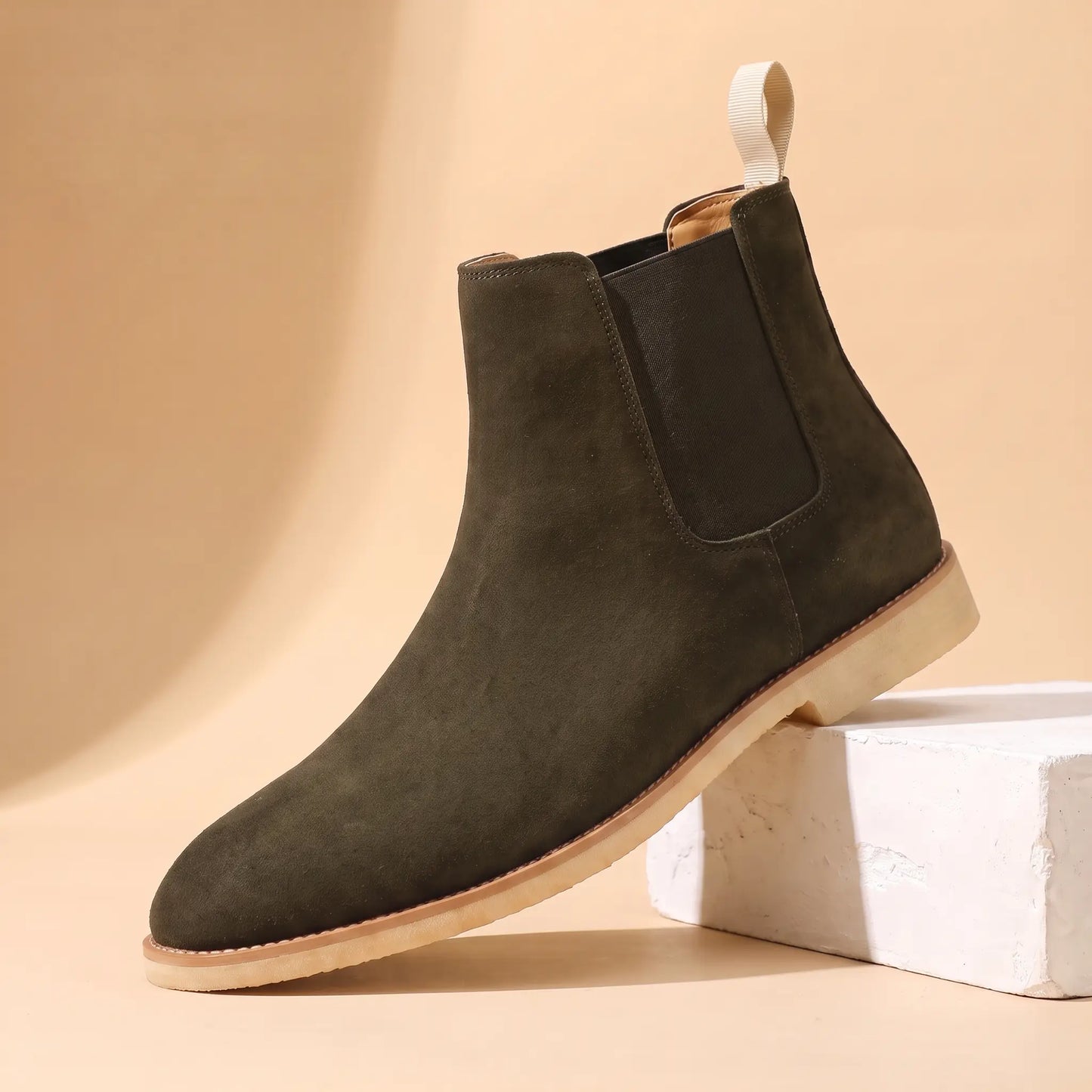 Webbing Tab Boots in green, a leather Chelsea boot with a cream heel pull loop