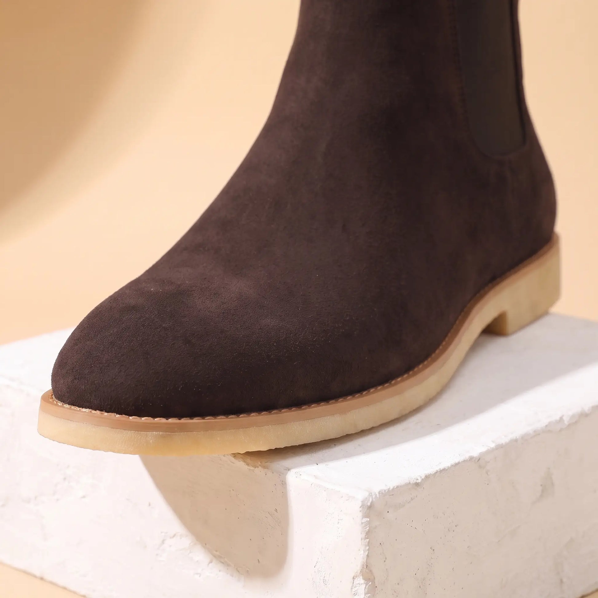 Close up of the round toe, stitched welt and flat sole on the Webbing Tab Boots