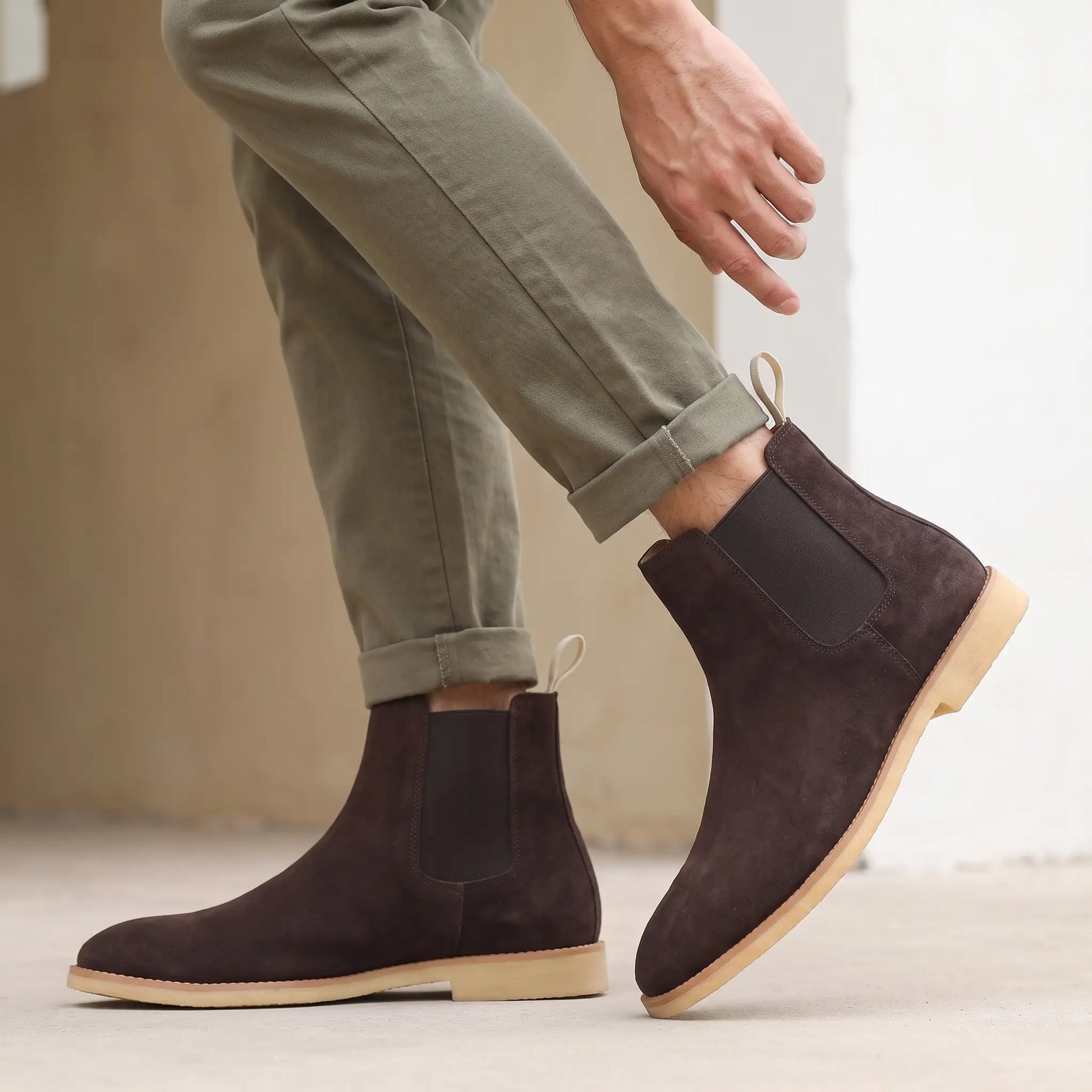 Man wearing the Webbing Tab Boots, settling his trouser cuff over the boot